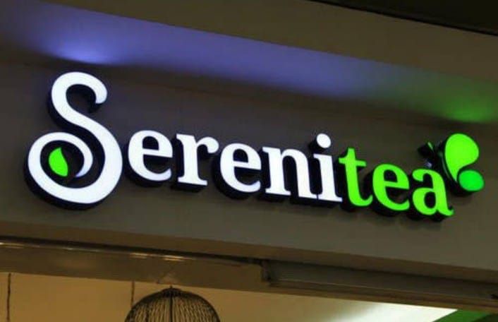 Illuminated LED channel letters on a shop facade